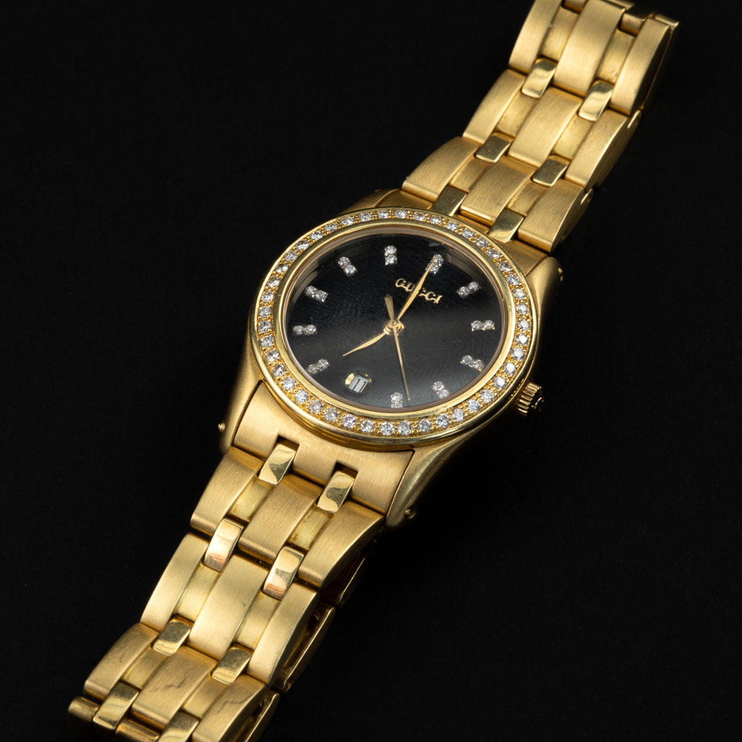 Orologio in oro 18kt e diamanti frimato Gucci